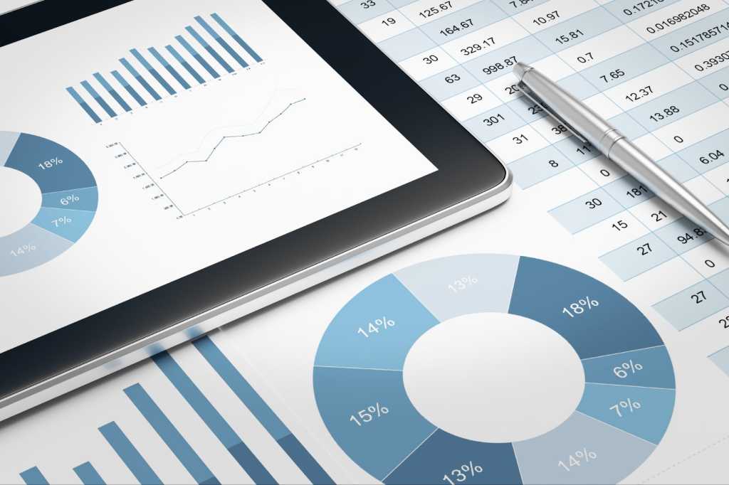 digital tablet and financial report on table 000067447463 medium