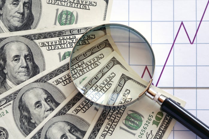 hundred dollar bills magnifying glass